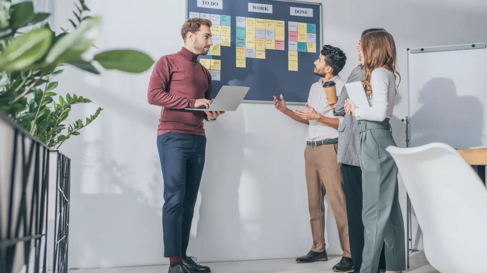 A scrum master leading a meeting.