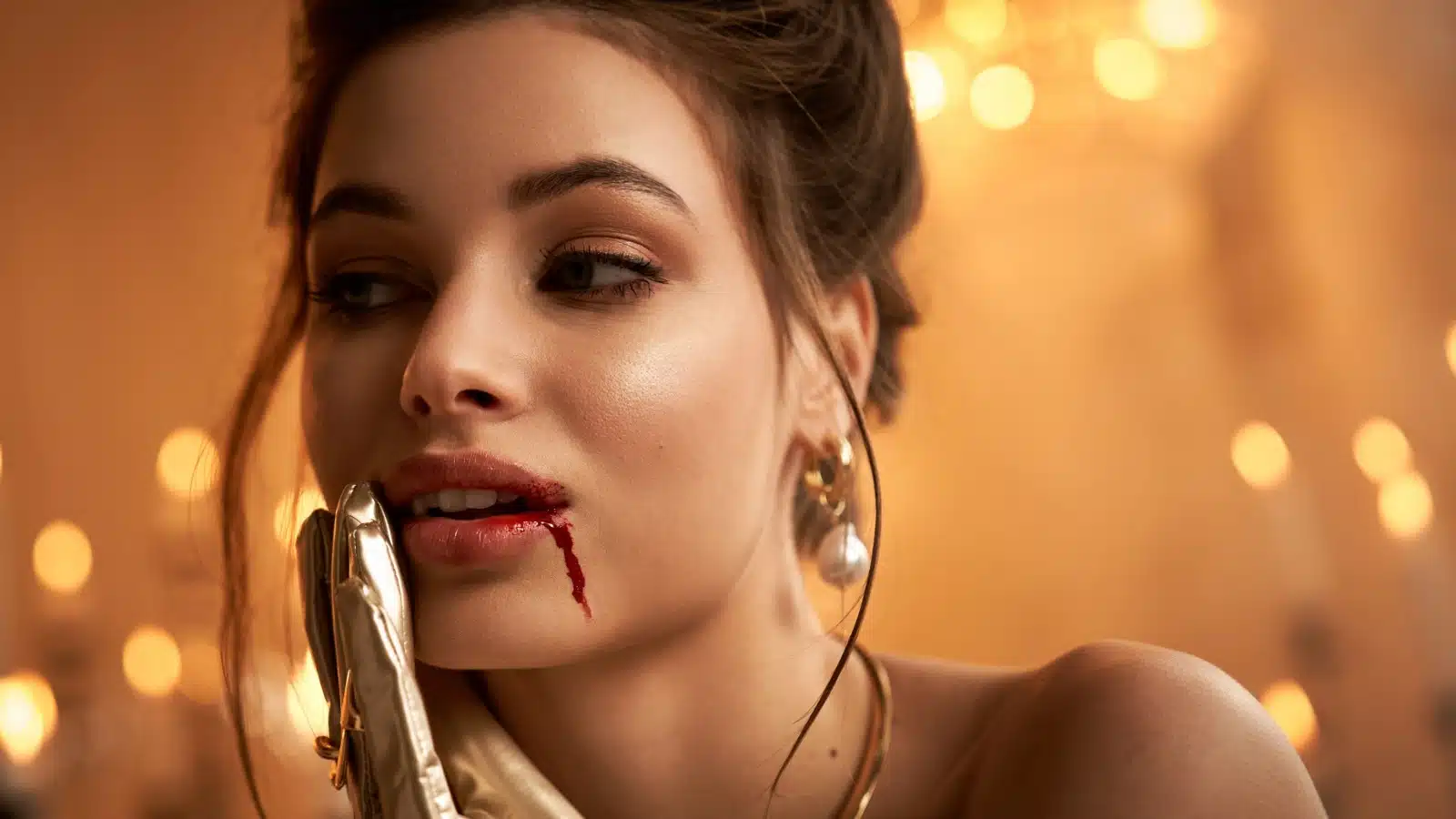 A well-dressed, seductive looking female vampire with a trickle of blood running down her chin to indicate she's recently fed.