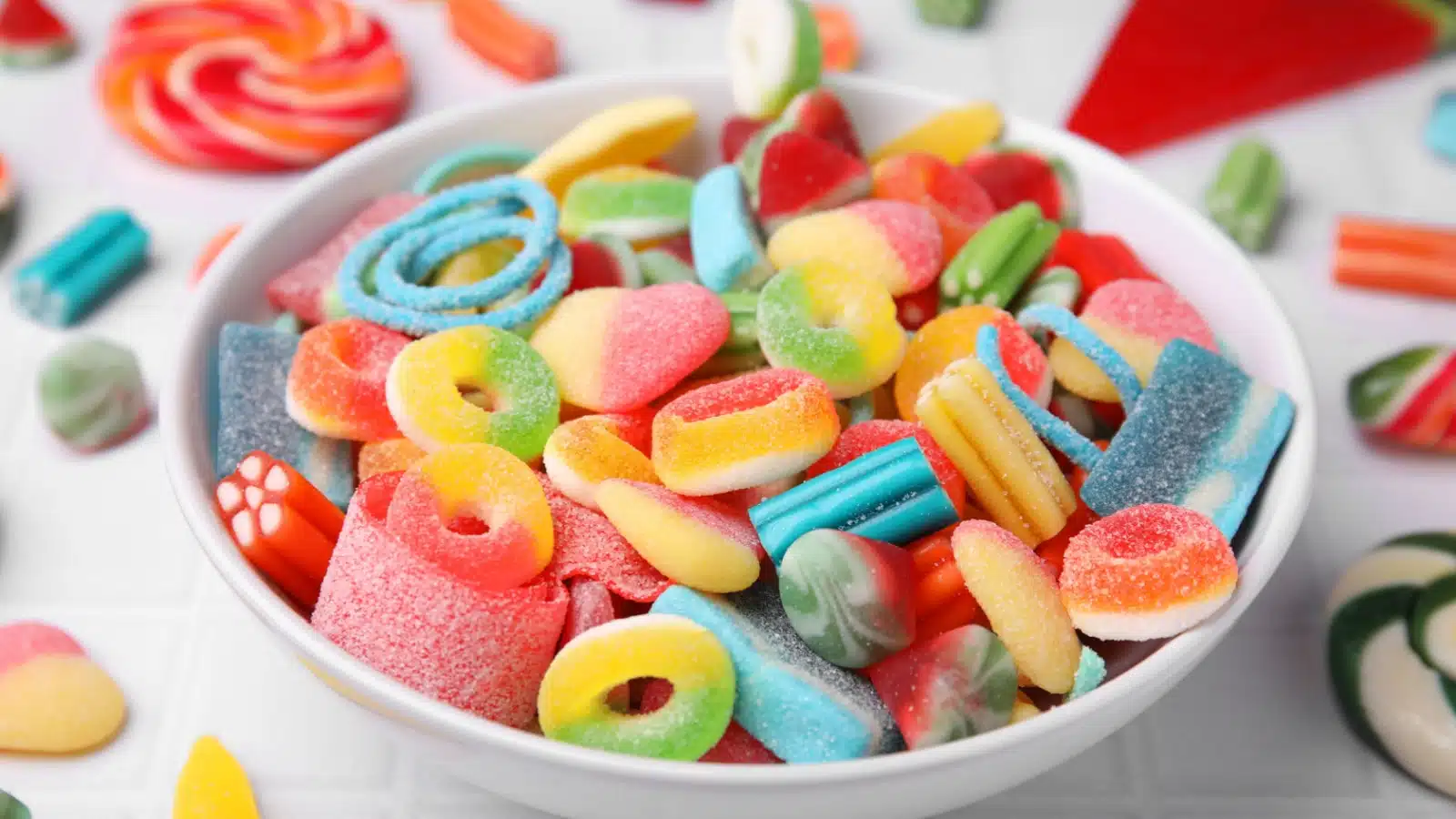 Bowl of gummy candy on a table.