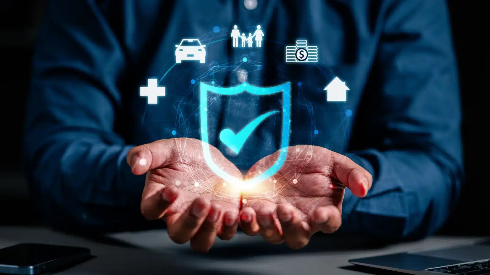 Insurance concept. Hands cup an insurance icon, which is surrounded by little icons representing various types of insurance like home, life, car, and health.