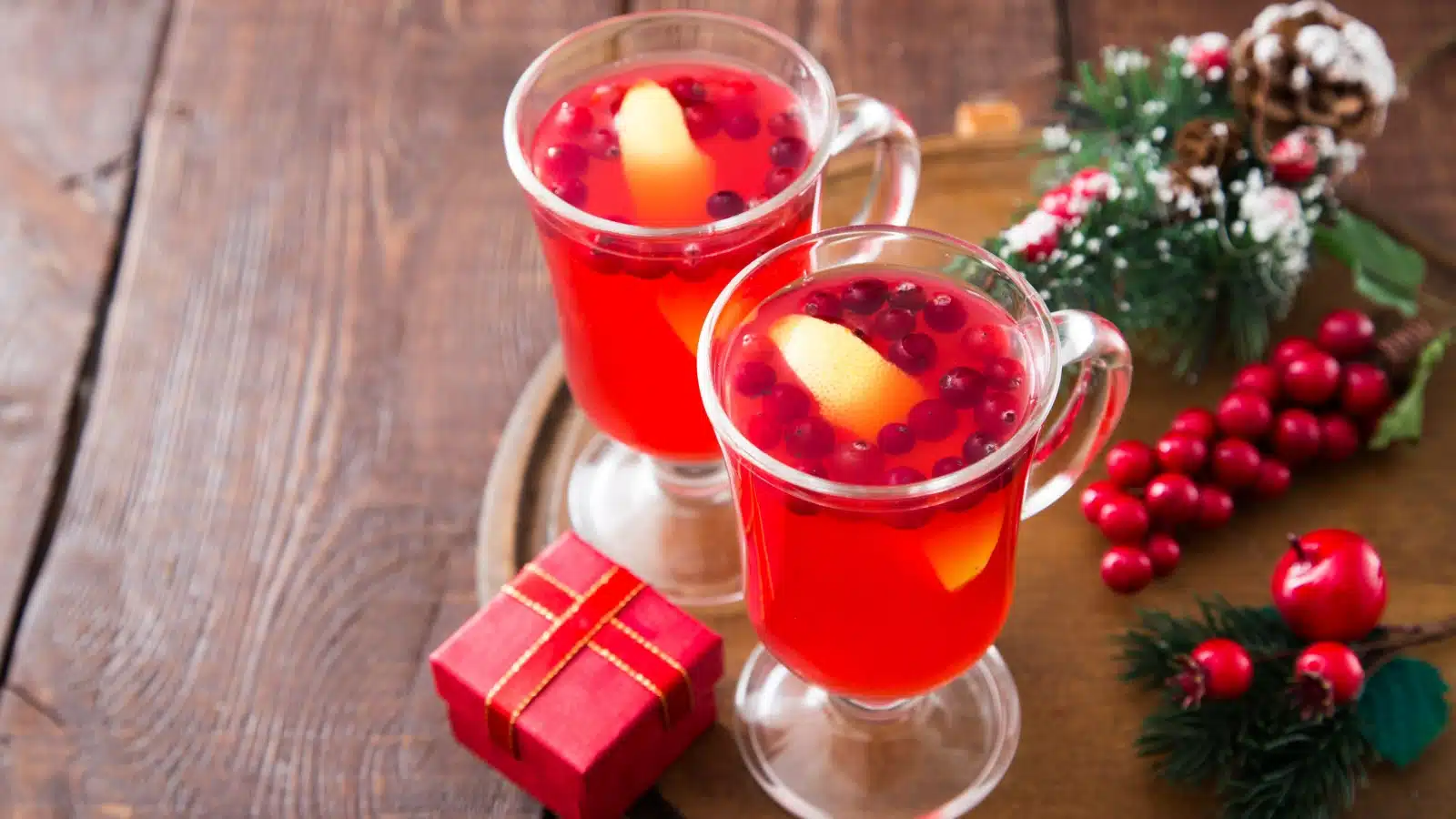 Two cranberry Christmas cocktails.