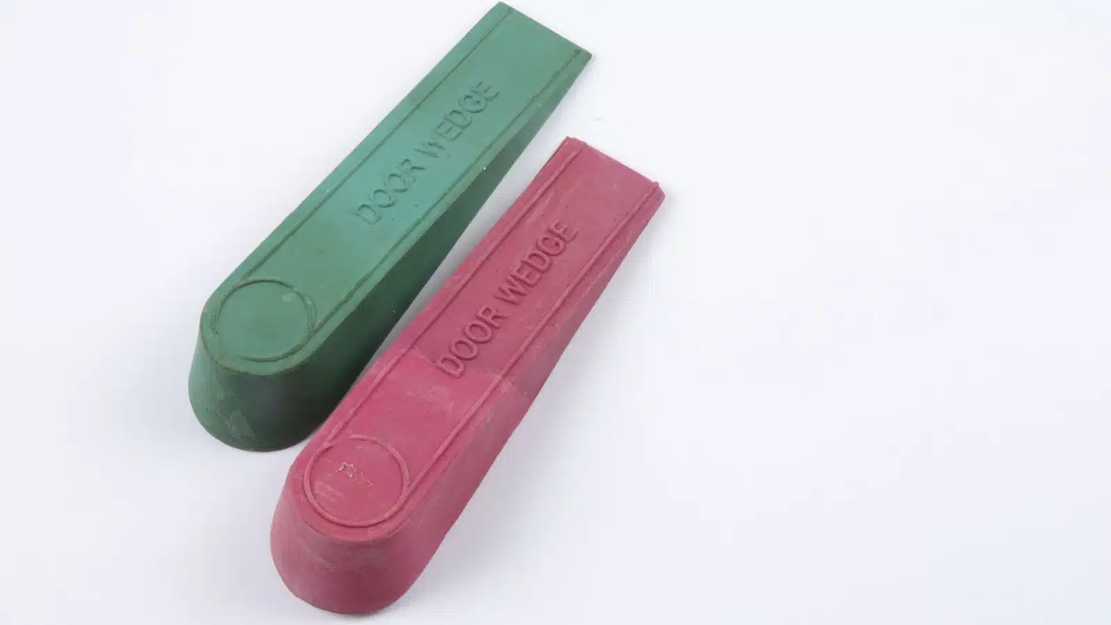 A pair of simple door wedges to prevent a door from opening.