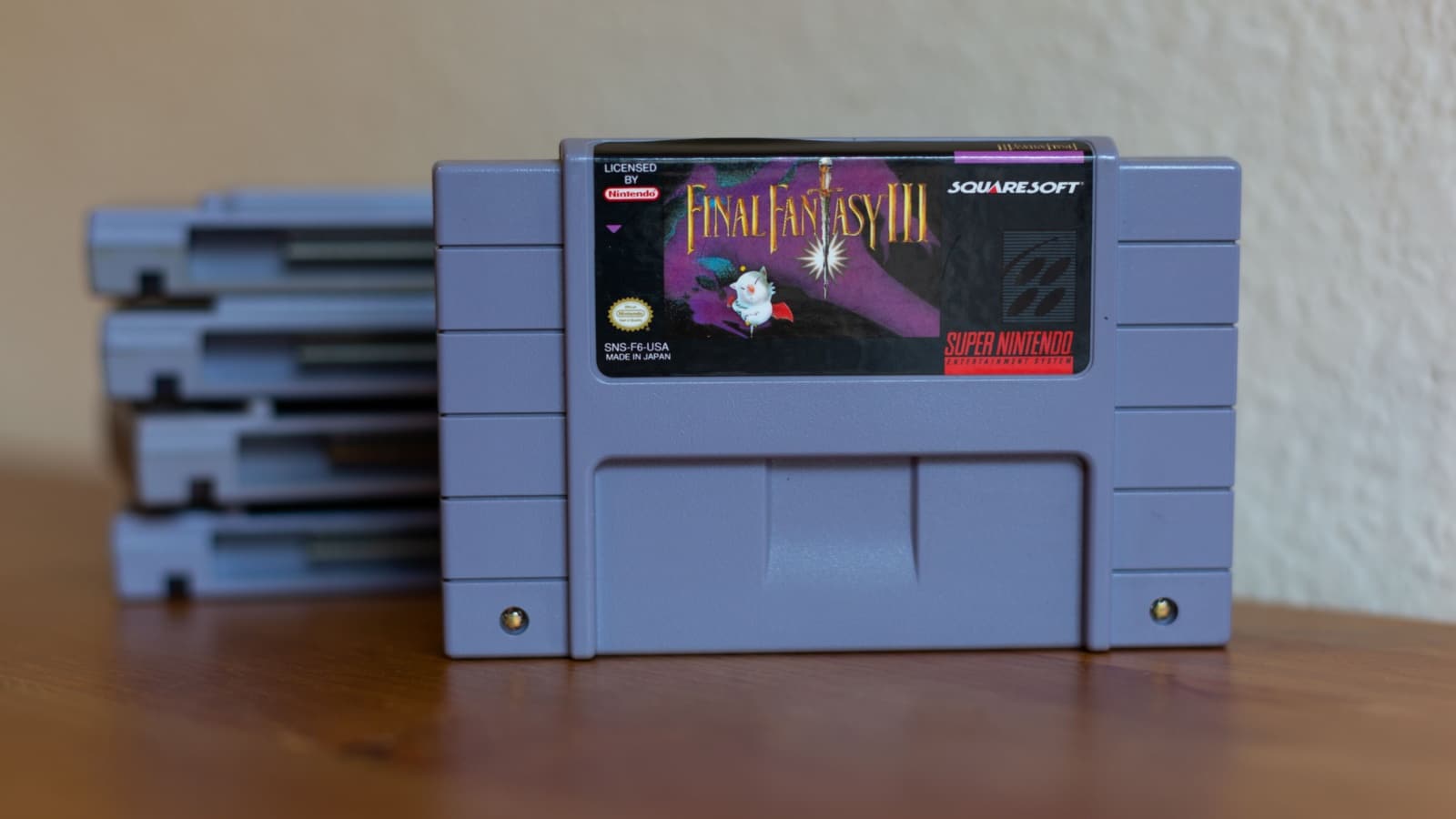 A Final Fantasy 3 video game cartridge for Super Nintendo.  