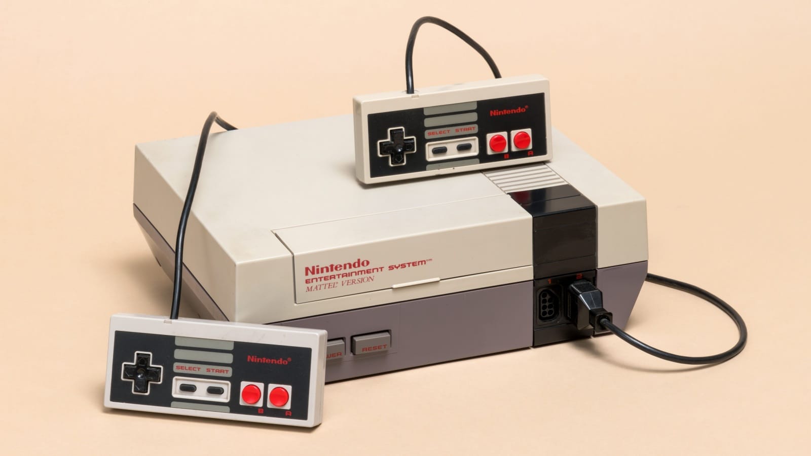 A vintage original Nintendo Entertainment System with two controllers. 