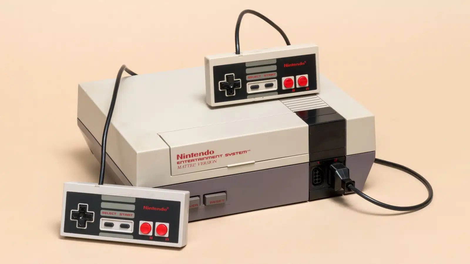 A vintage original Nintendo Entertainment System with two controllers.