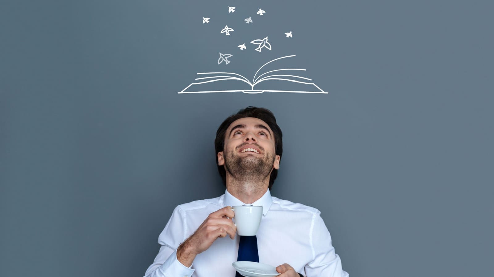 An author looks up, imagining his story, to represent creative writing. 