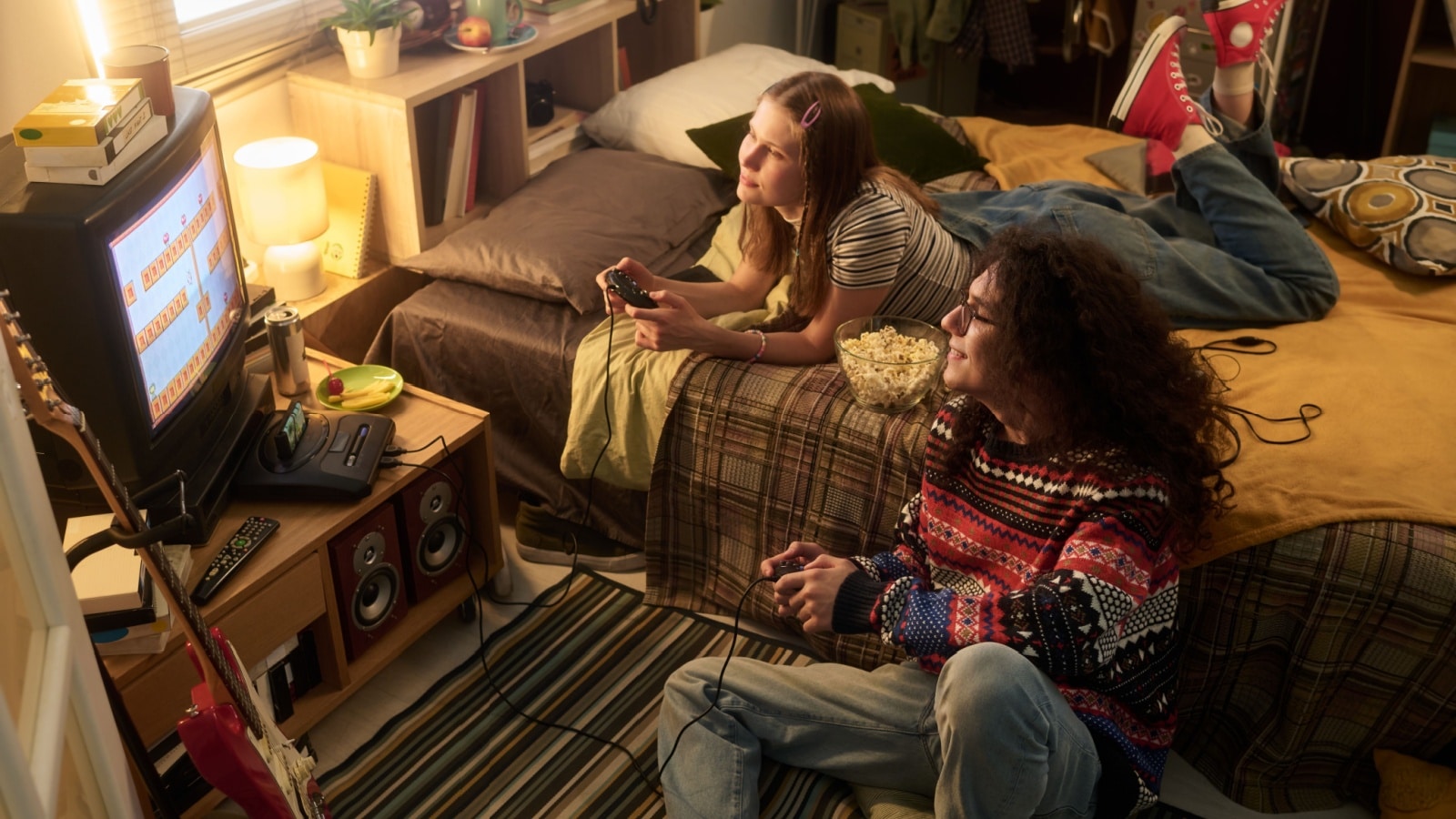Friends playing a retro game on a vintage television. 