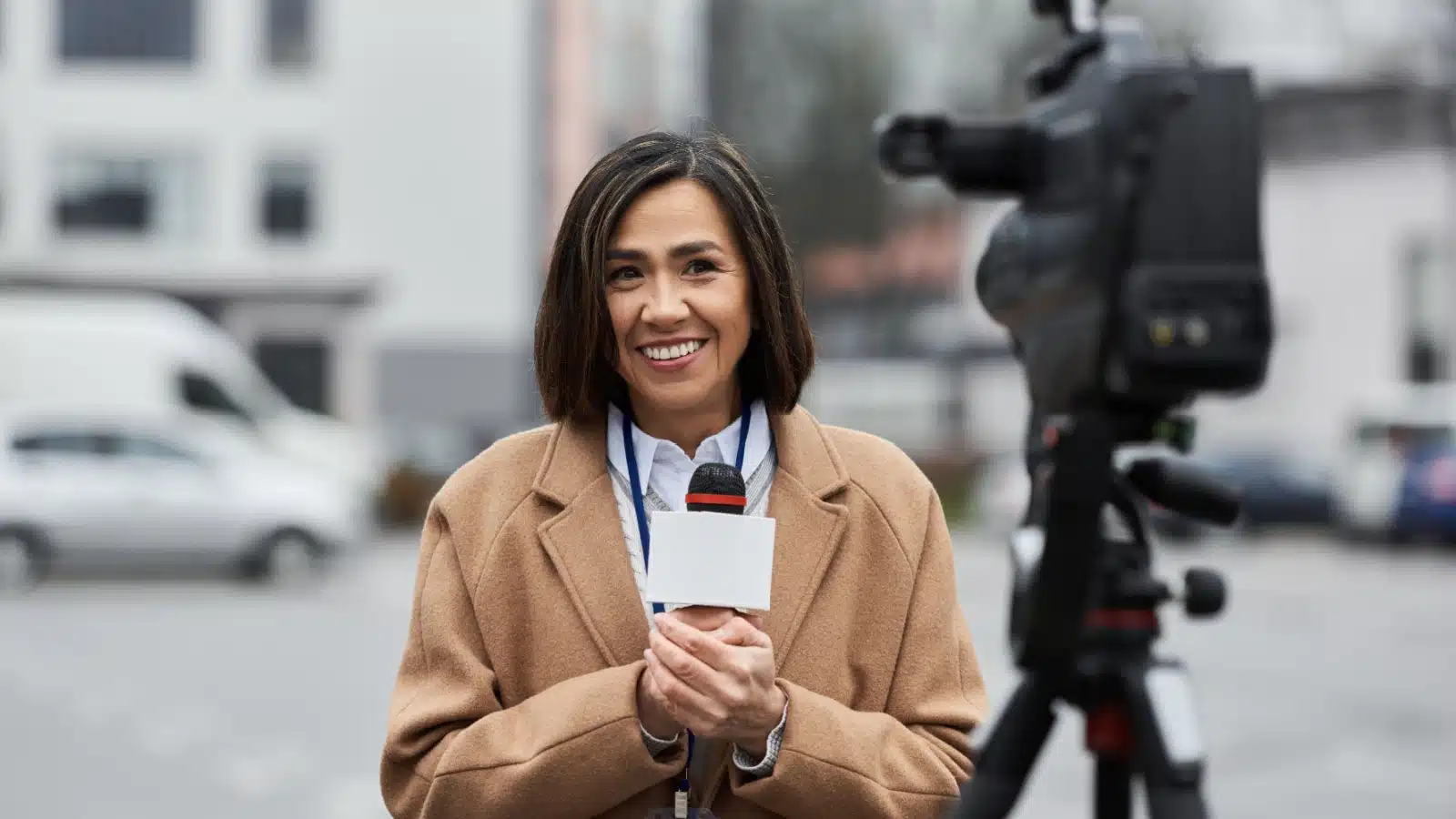 A journalist reports on location.