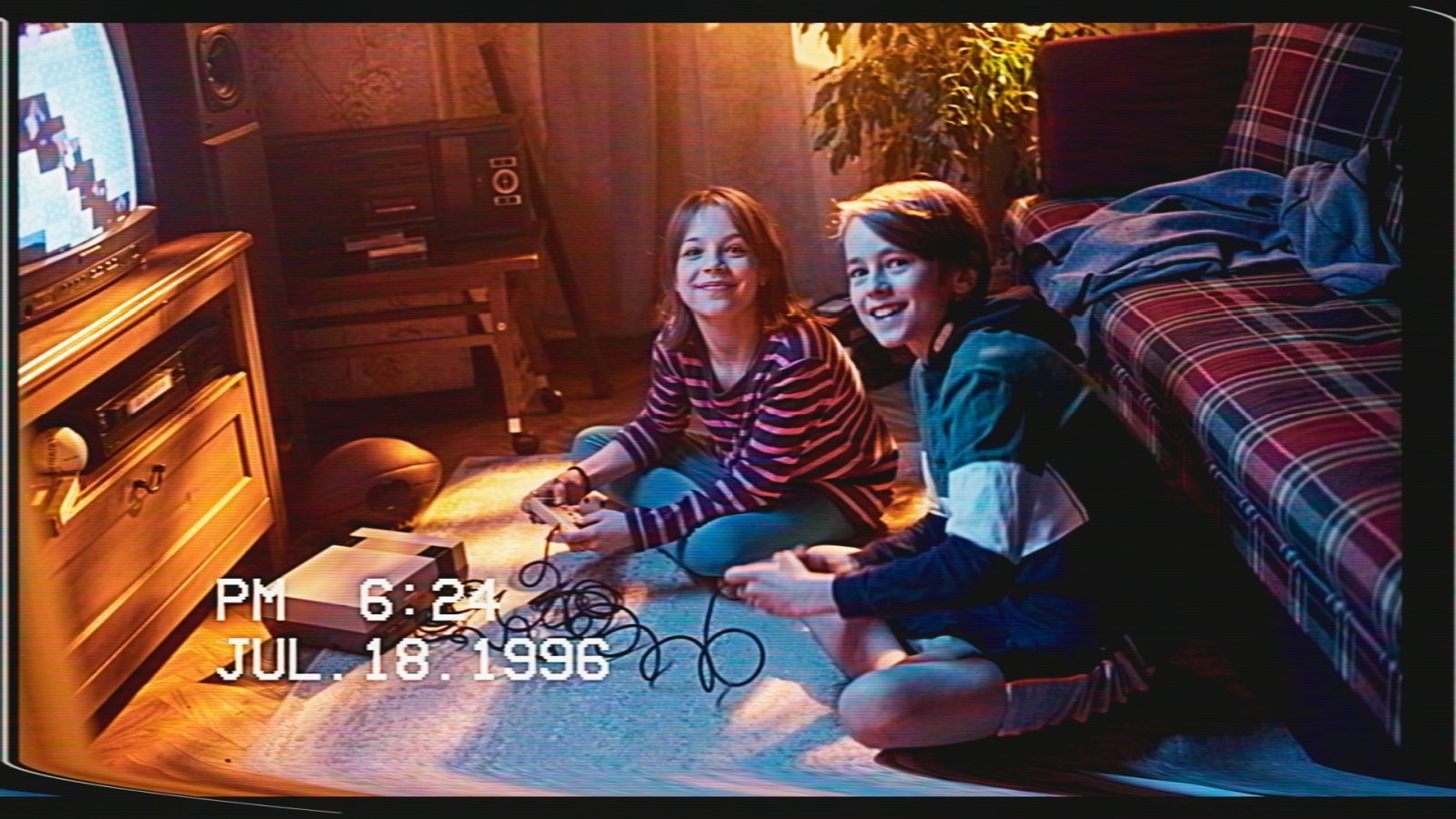 A vintage photo of kids in the 1980s playing on their Nintendo Entertainment System (NES) to represent the best retro games. 