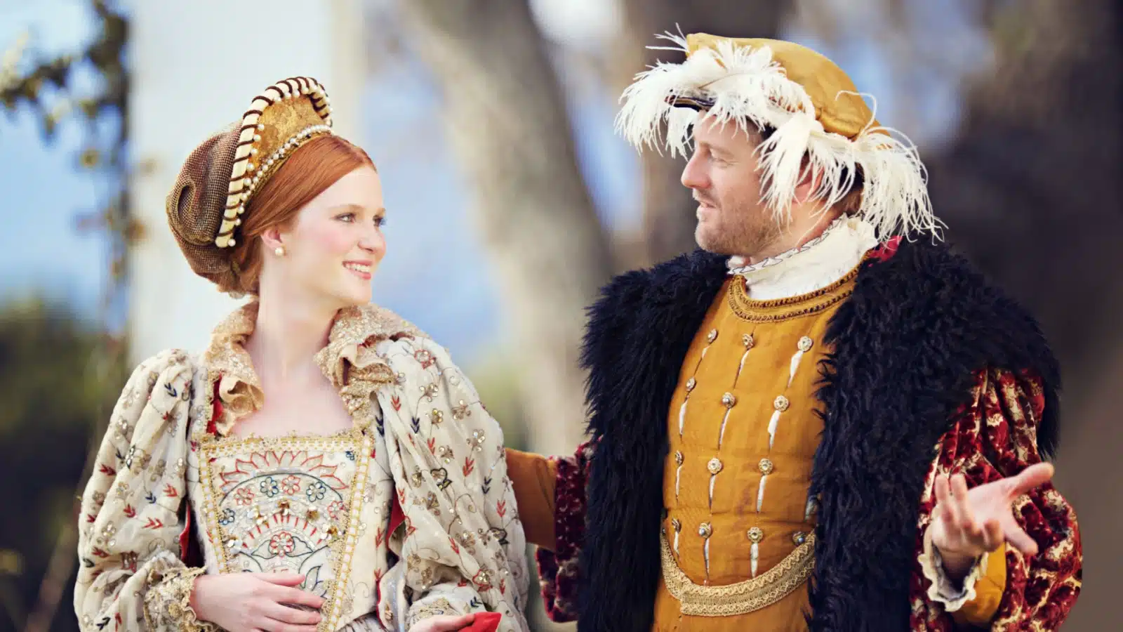 Historical representation of a medieval king and queen talking outside. 