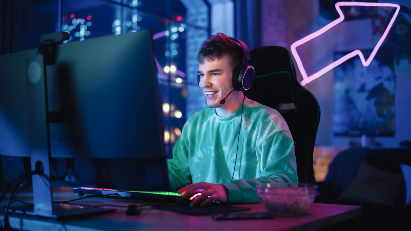 A man plays a video game on his computer.