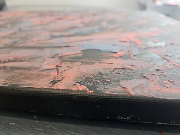 Side view of Rugged Individualism showing canvas depth and texture.