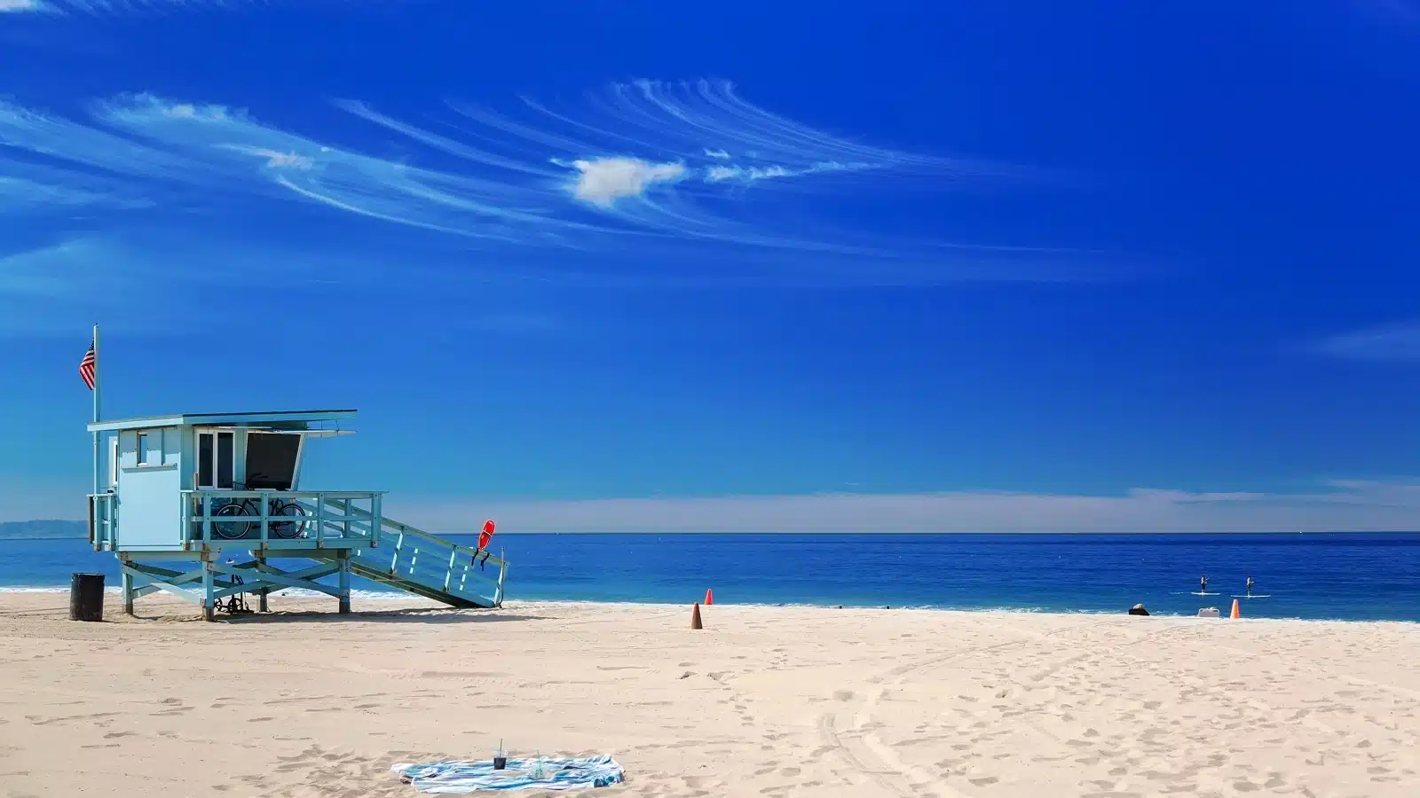 A lifeguard station sits in the sand at Hermosa Beach, CA.