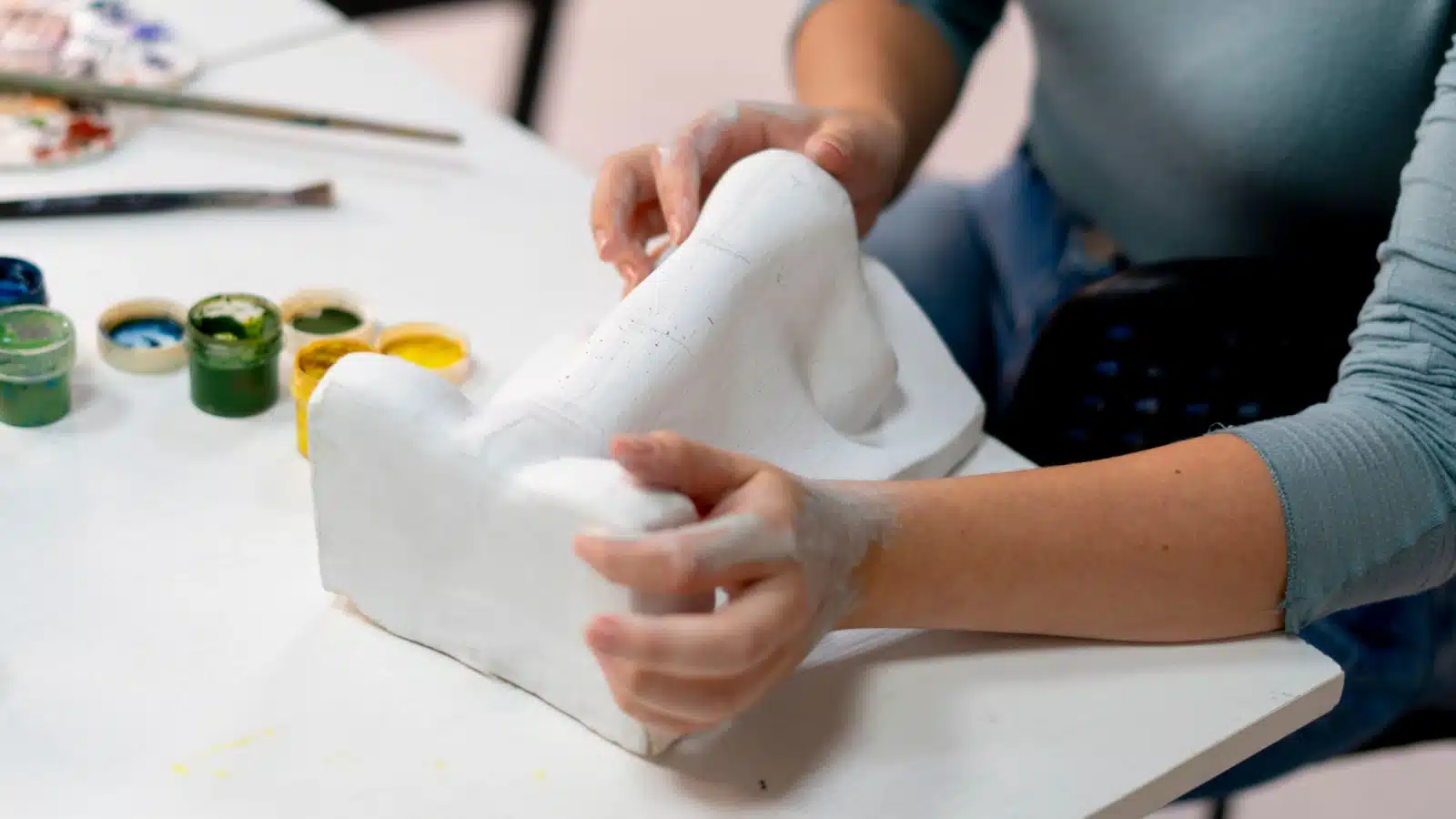 A hobbyist learning to make a sculpture.