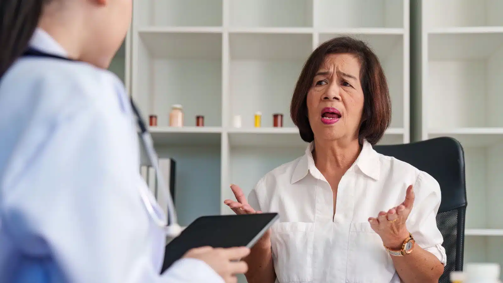 A woman advocates for herself at a doctor's appointment.