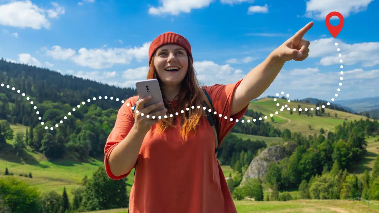 A smiling woman on an adventure holds her phone while pointing to a destination icon overlayed across the photo to represent a travel route.