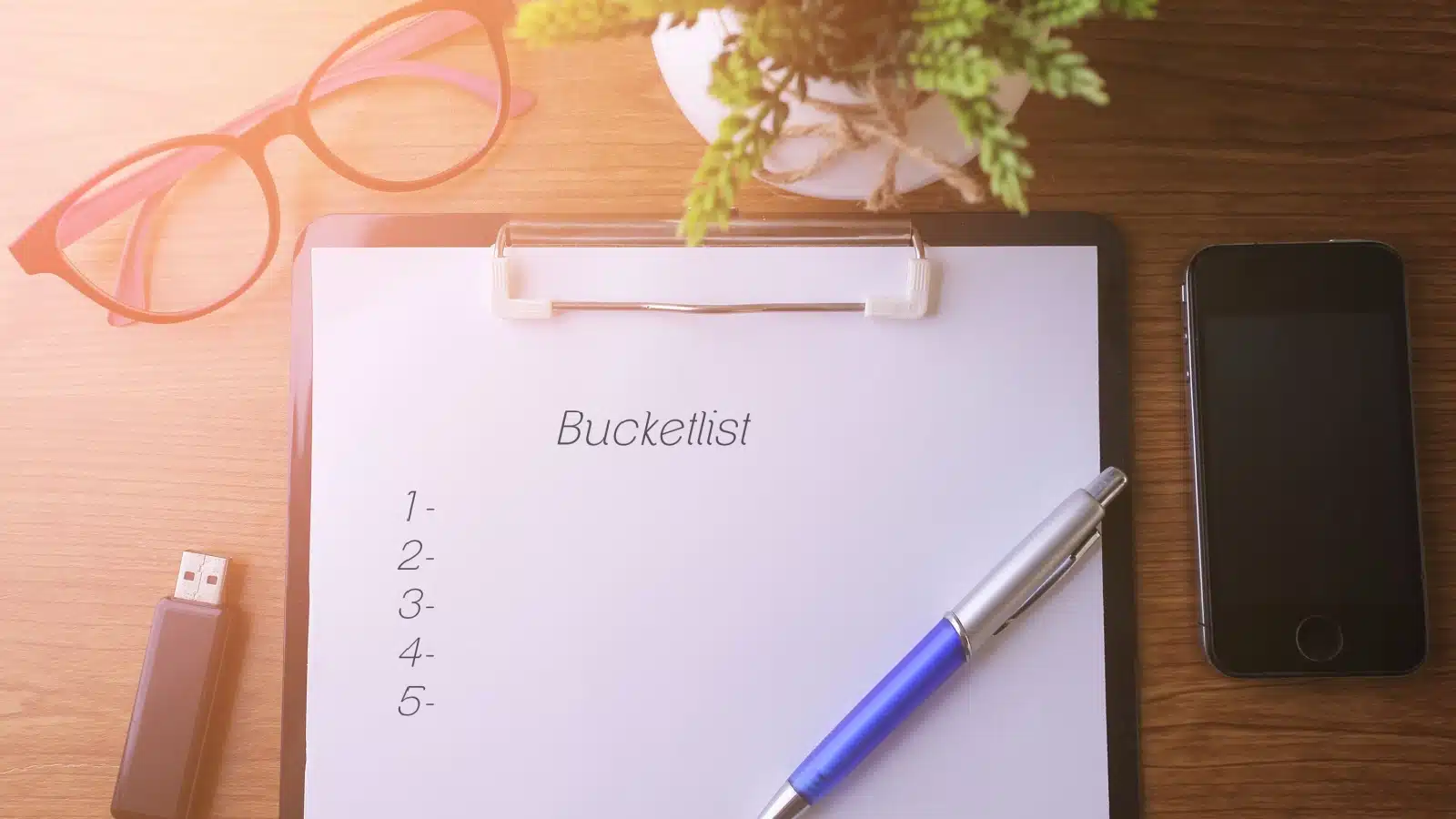 A clipboard with a blank bucket list. 