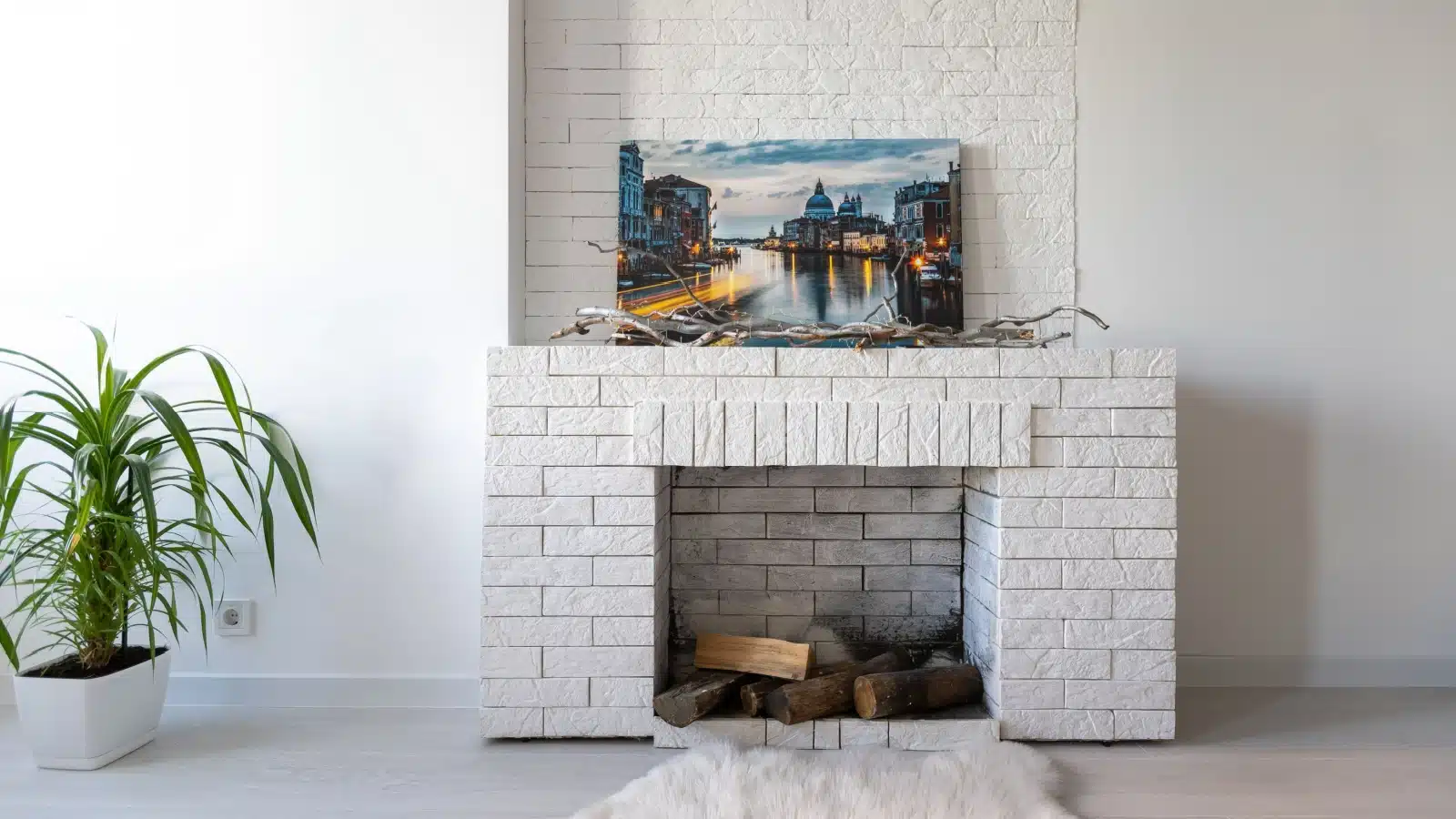 modern looking clean fireplace with decorated mantle.
