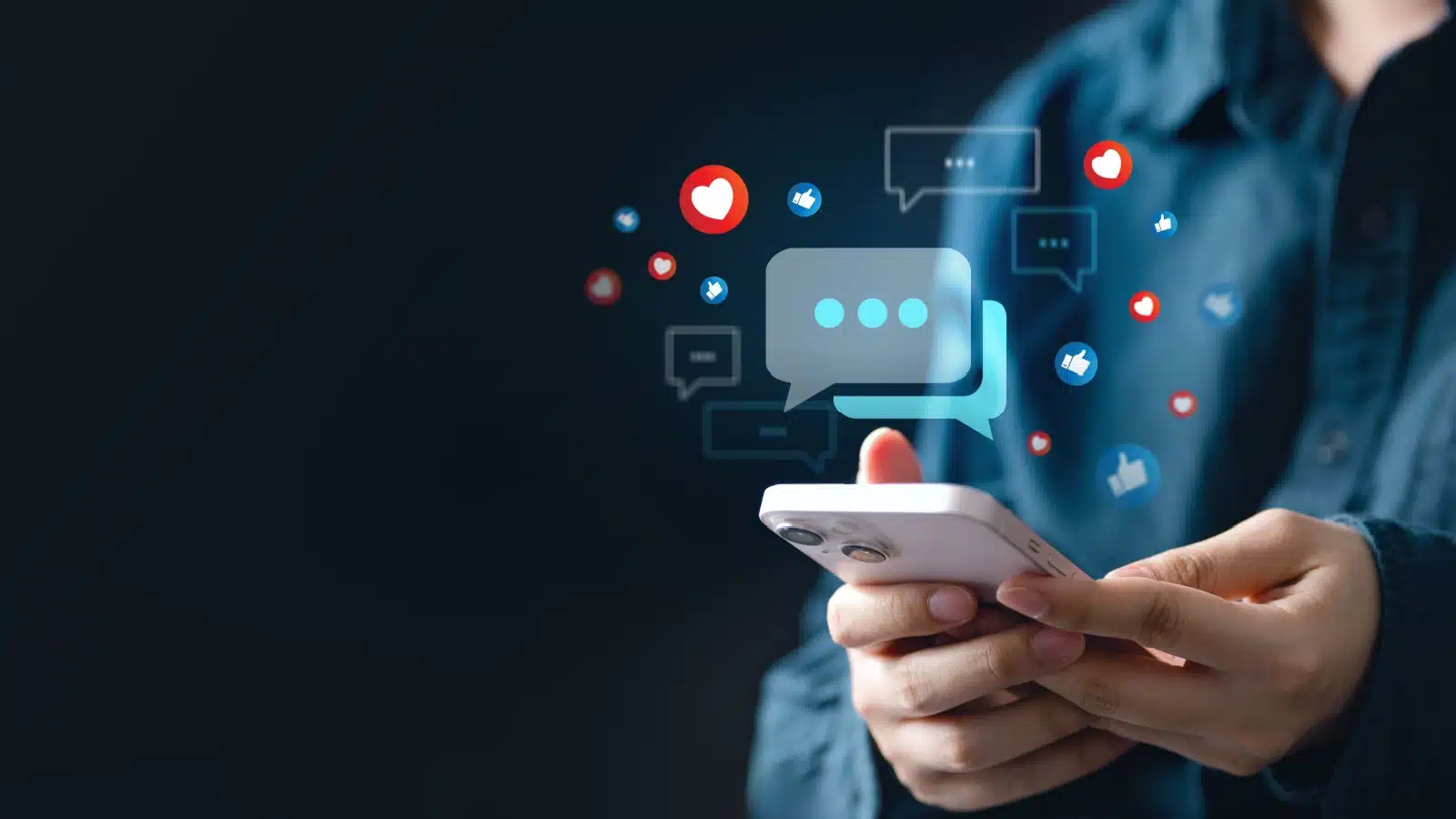 A person holds their cellphone, engaging online with chat, text messages, and social media emojis.