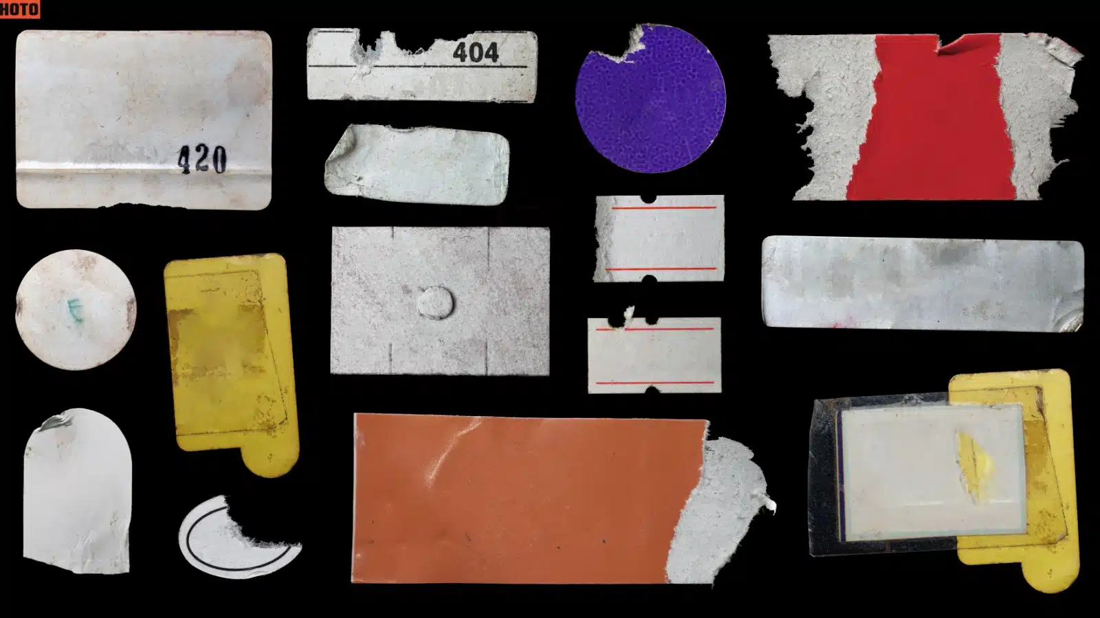 An assortment of old paper scraps, stickers and ephemera that could be used in a junk journal.