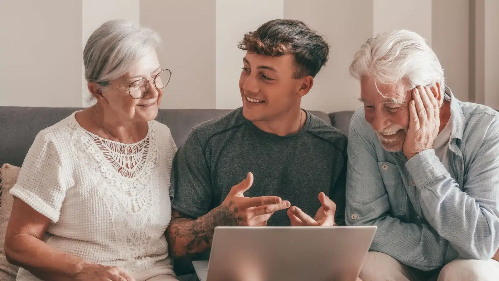 A young adult spends time with his grandparents.