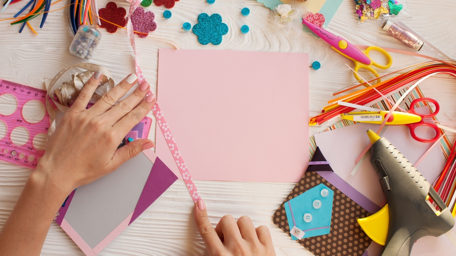 Various paper craft supplies to represent vision board supplies.