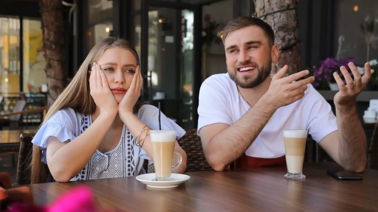 A woman is bored on a date while a man talks endlessly.