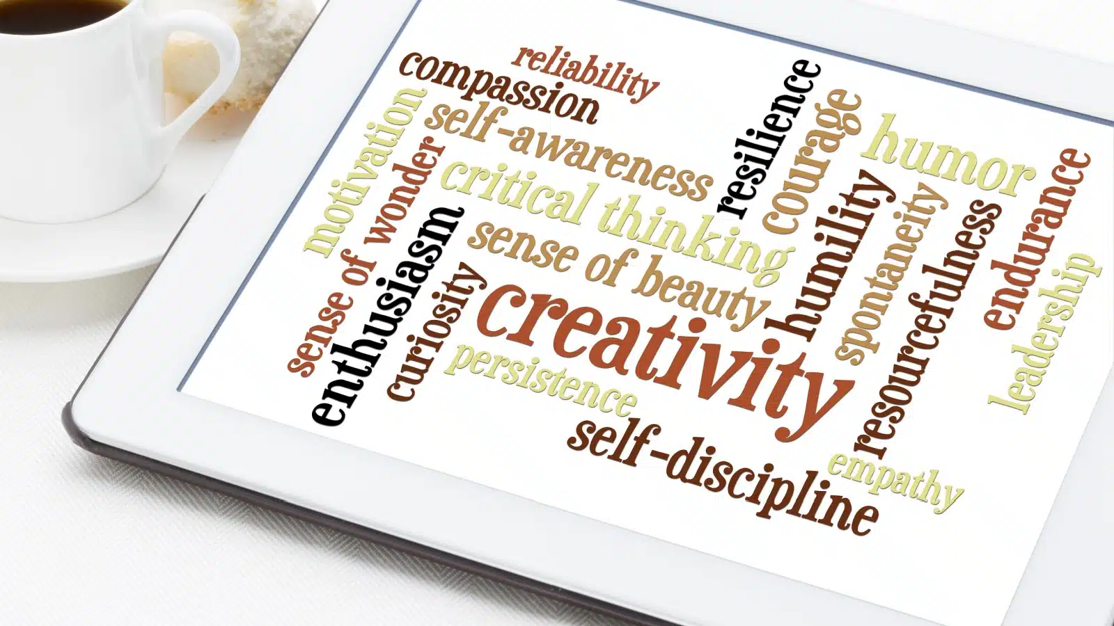 A tablet with examples of core values written in different colors and orientations. 