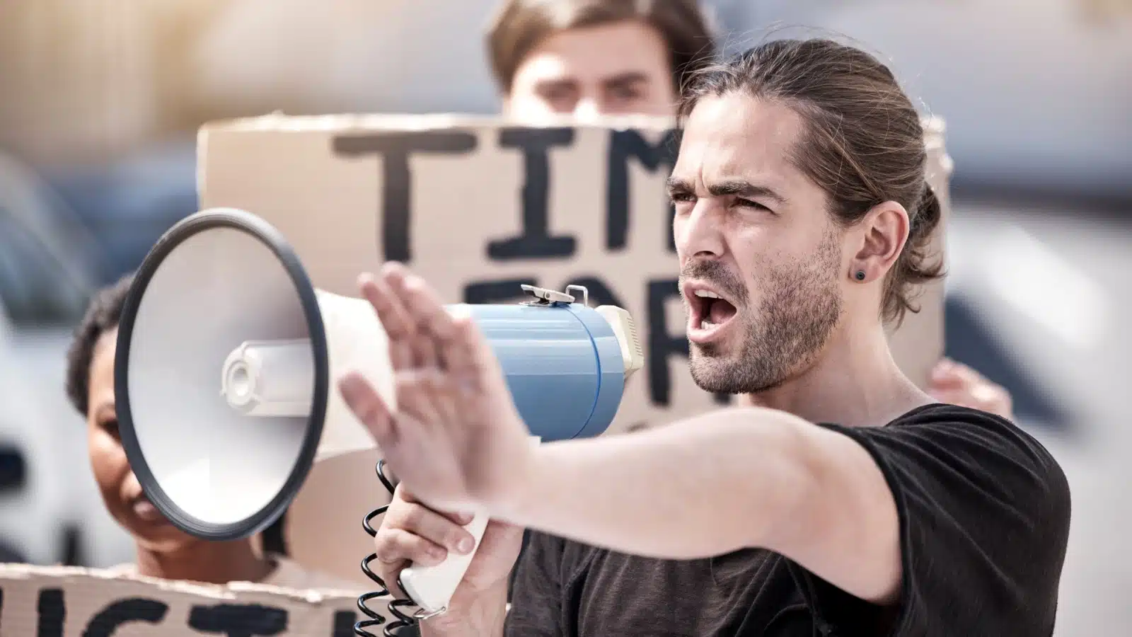 A male activist protesting for change.