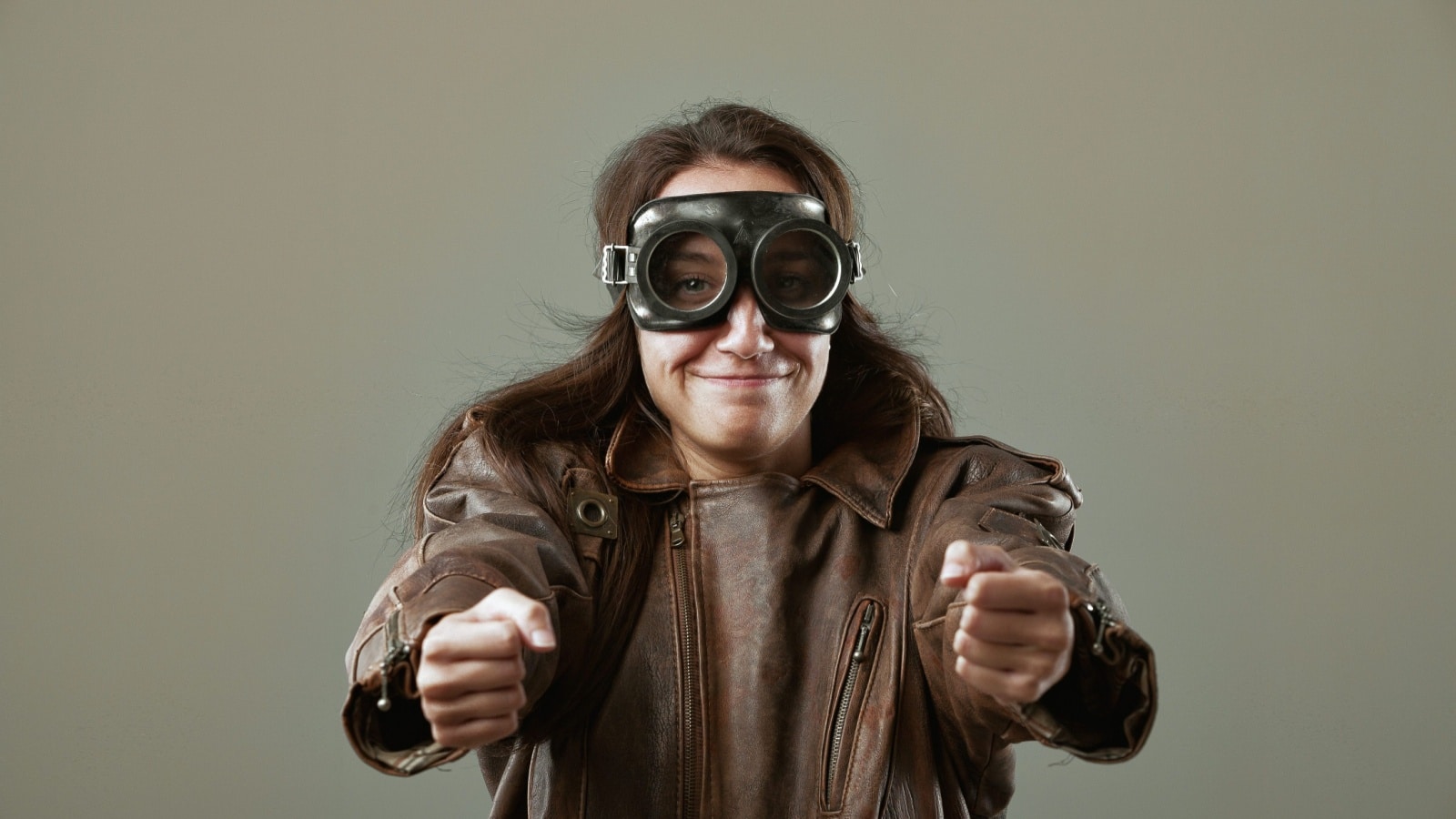 A woman role plays as a pilot.