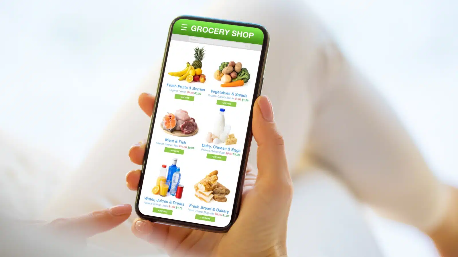 A woman uses an app to buy groceries online.