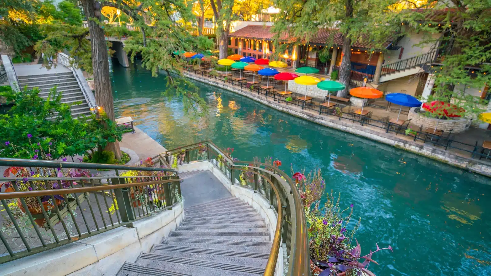 A staircase leading down to the San Antonio River Walk.