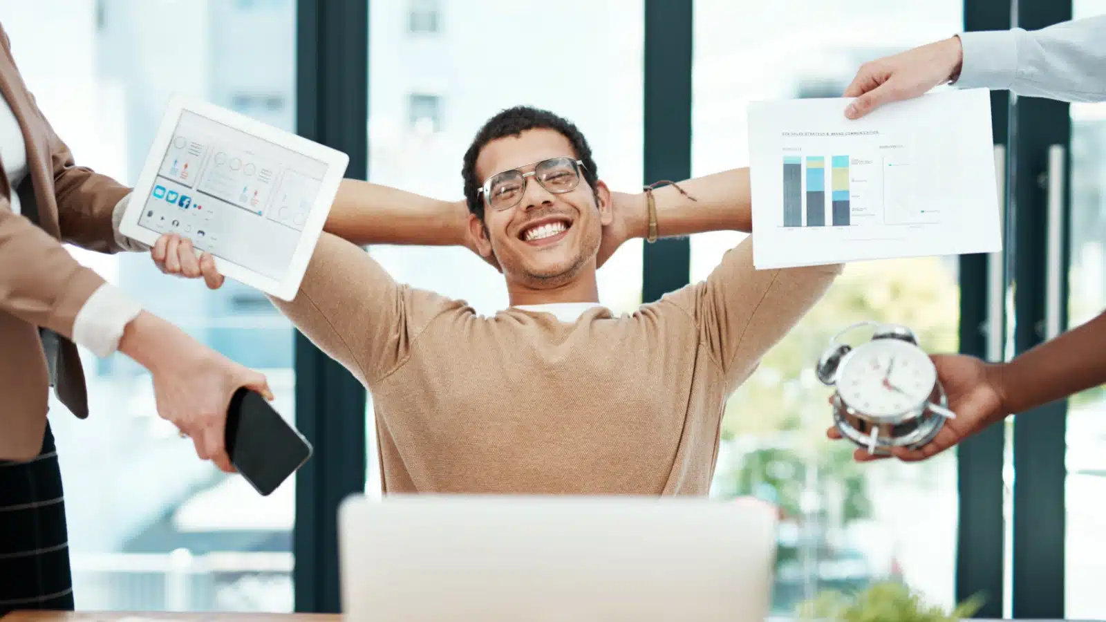 A man relaxes while multitasking on autopilot.