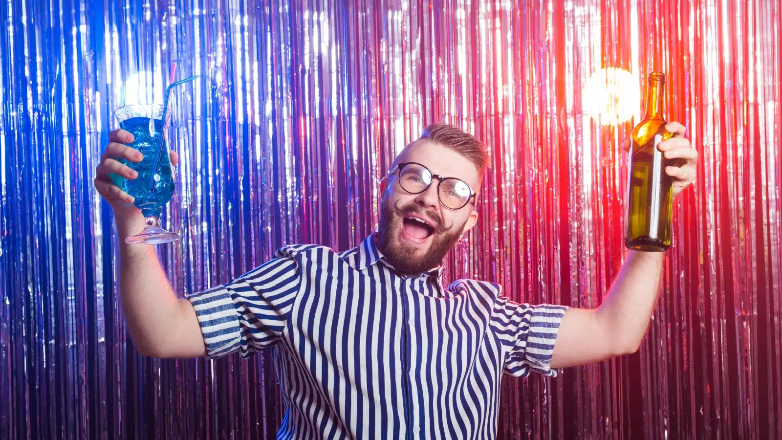 A happy man enjoying a party, but he represents party fouls.