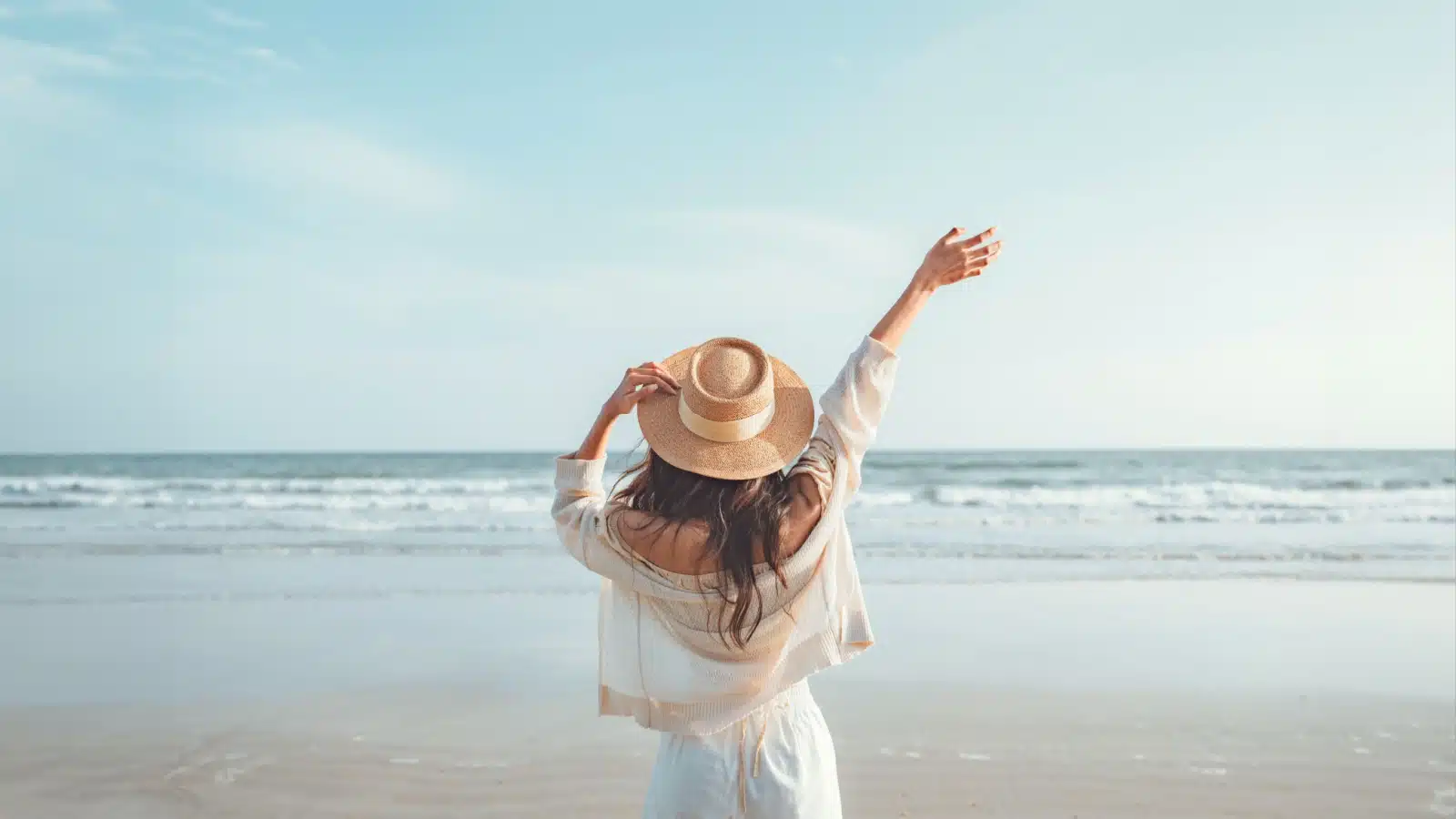A gorgeous woman enjoying a lovely beach on a beautiful summer day. 