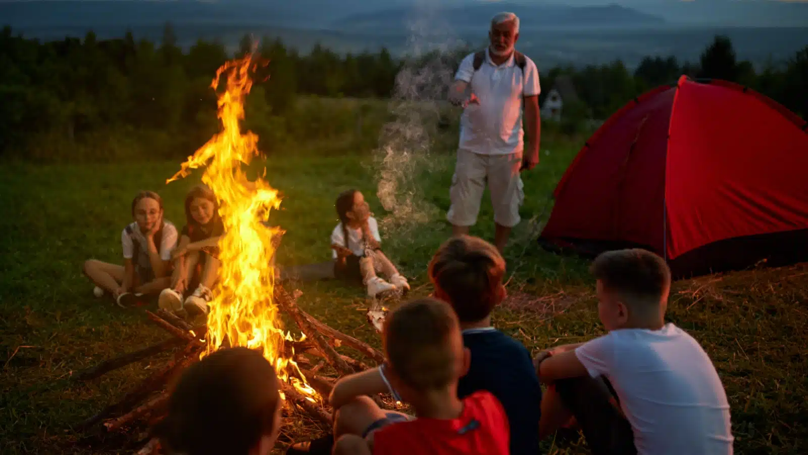Kids listening to campfire stories. 