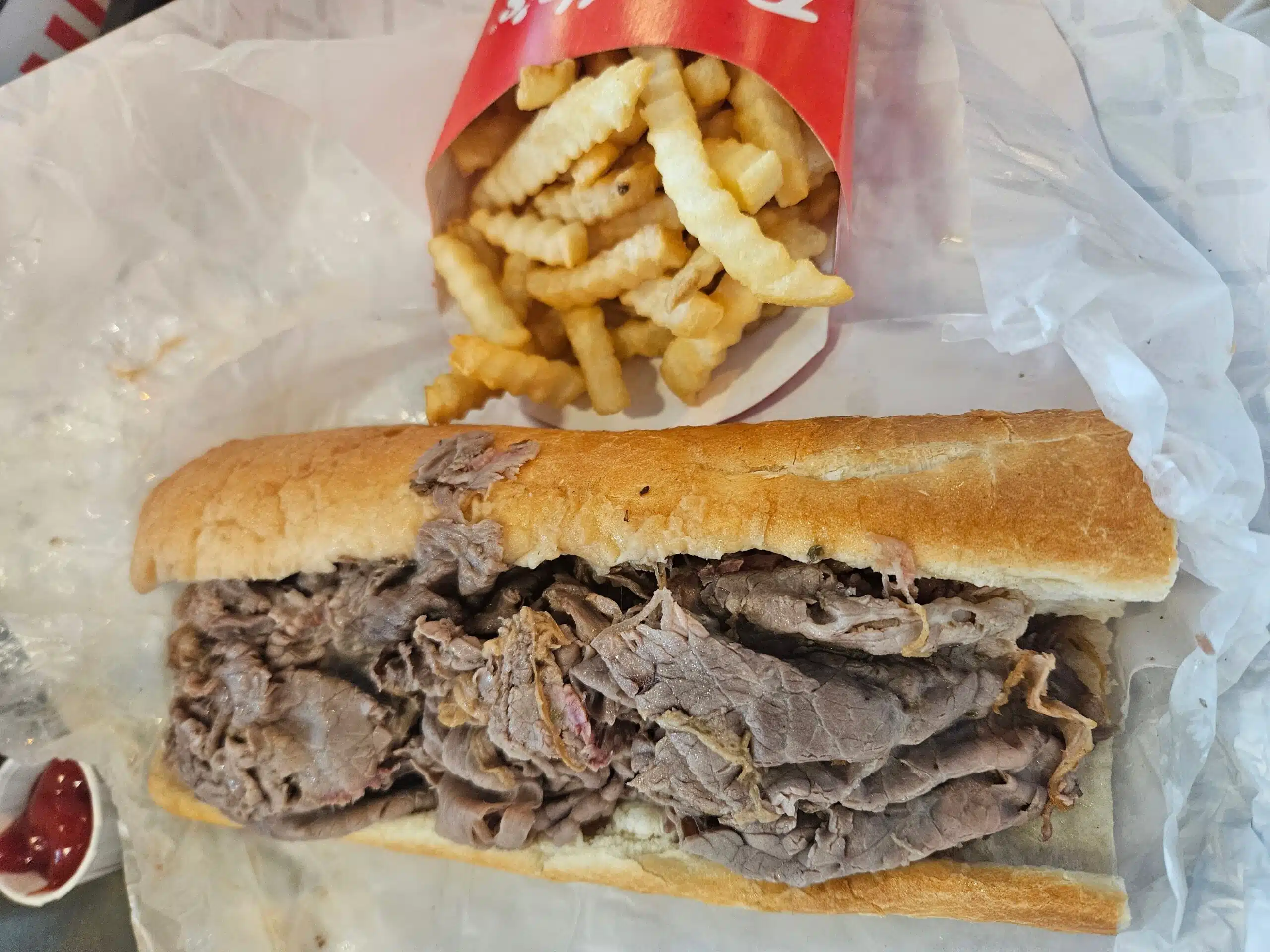 An Italian beef sandwich and fries from Portillos.
