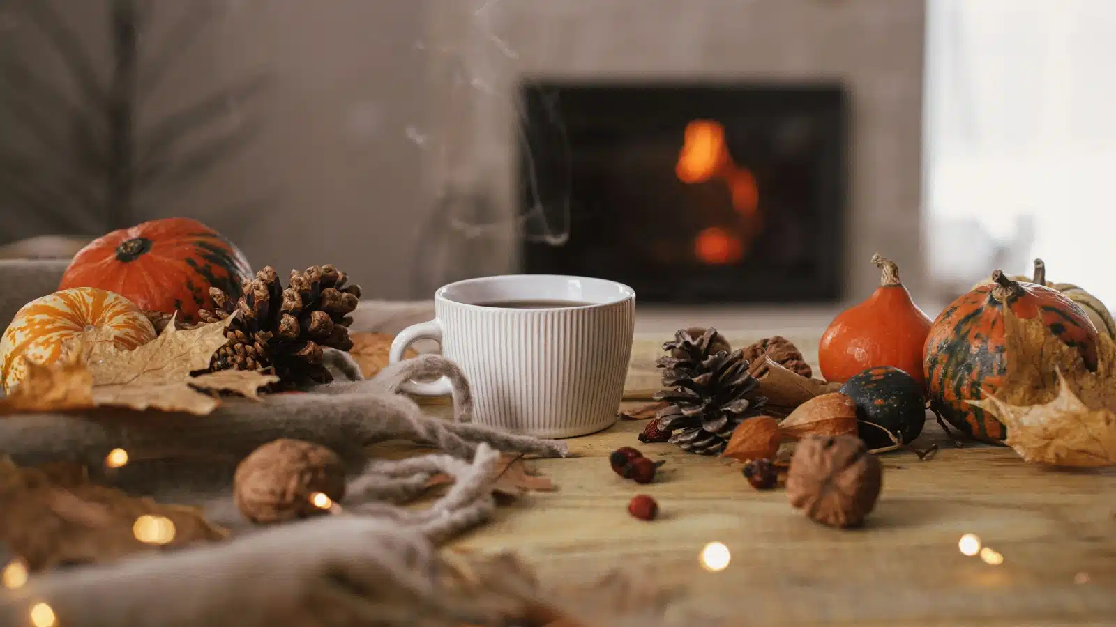 Fall trinkets on a table to represent a cozy autumn. 