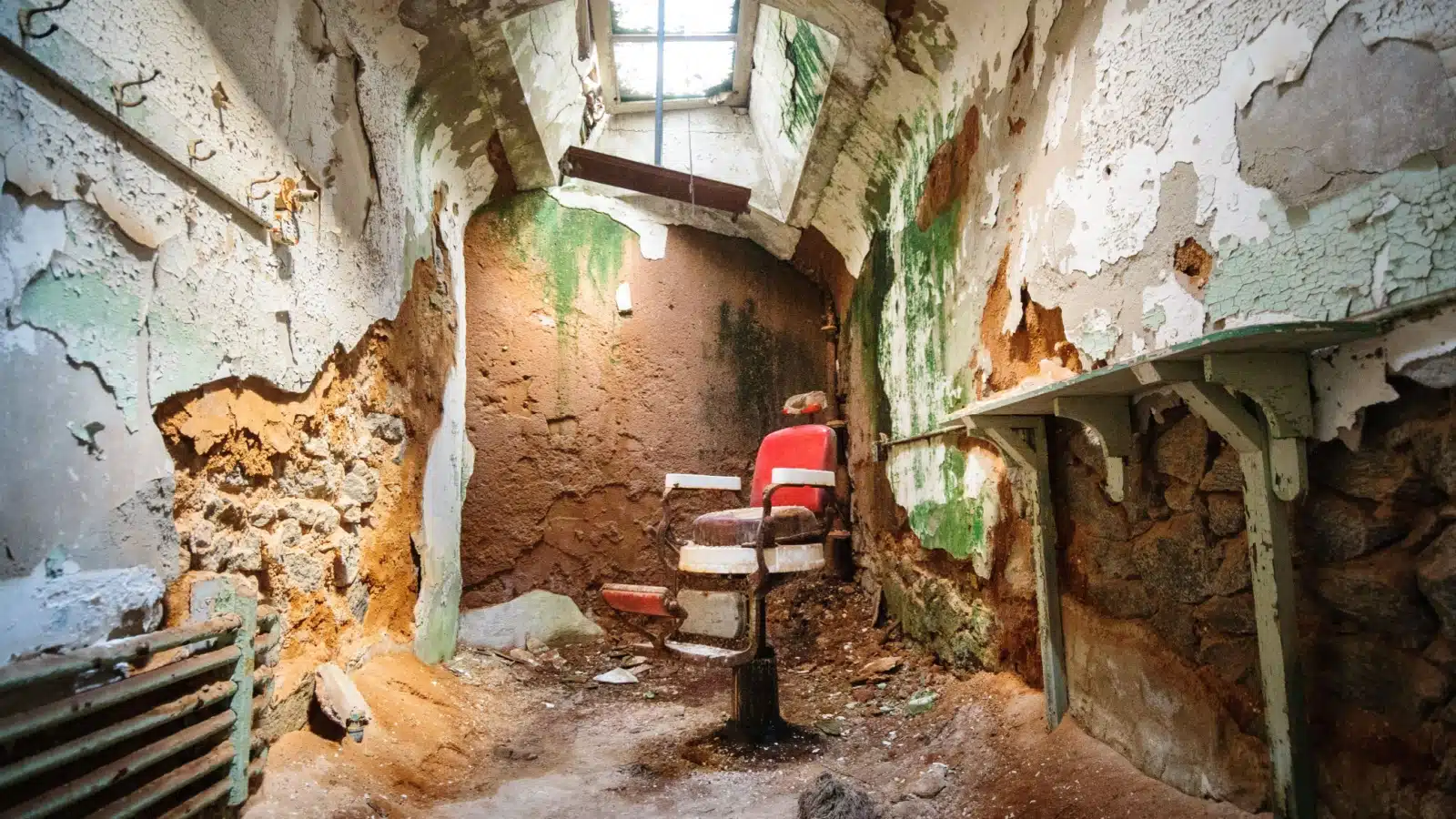 A red chair in a ruined room at Eastern State Penitentiary in Philadelphia.