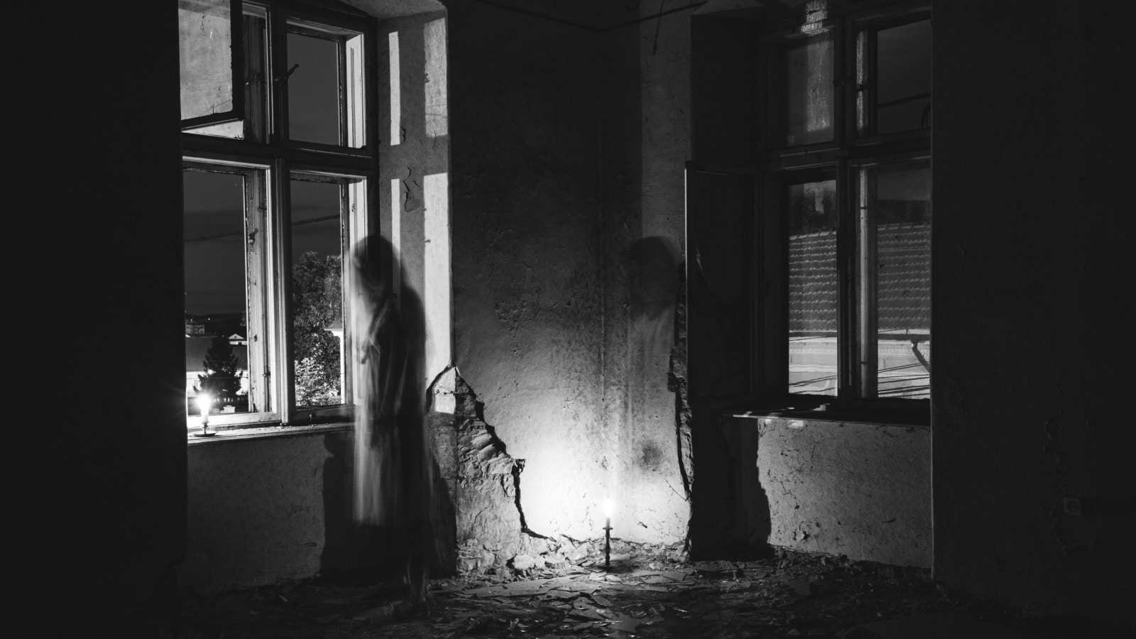 Apparitions in a black & white photo to represent the most haunted places in the United States.