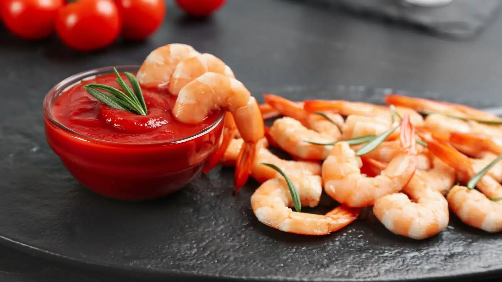 A serving of shrimp cocktail with sauce.