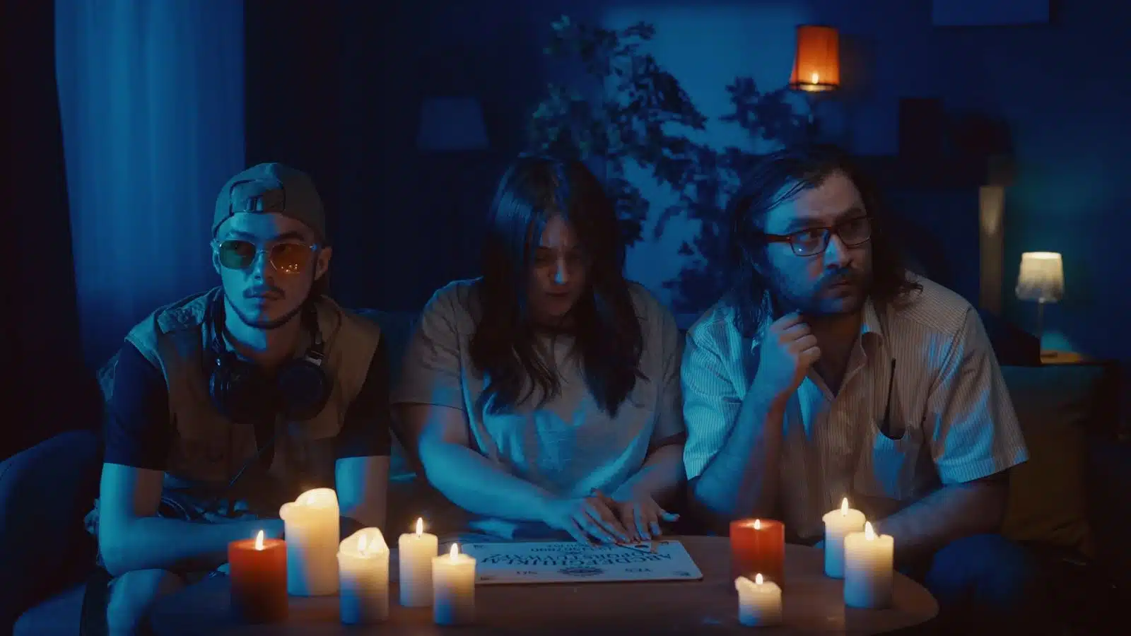 A group of friends having a Seance.