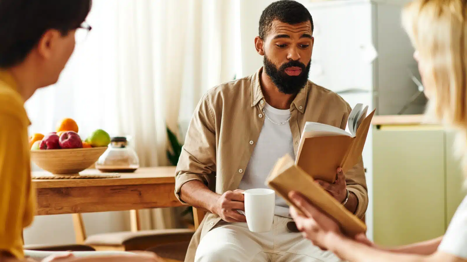 A group of friends discussing a novel at their book club meeting.