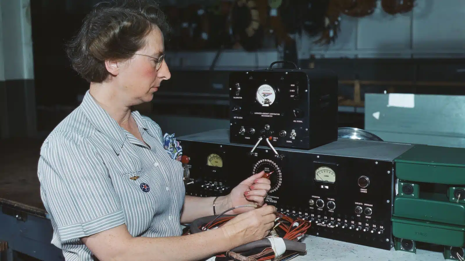 Woman electric wiring technician at Douglas Aircraft Company, Long Beach, California. During World War 2, Oct. 1942.