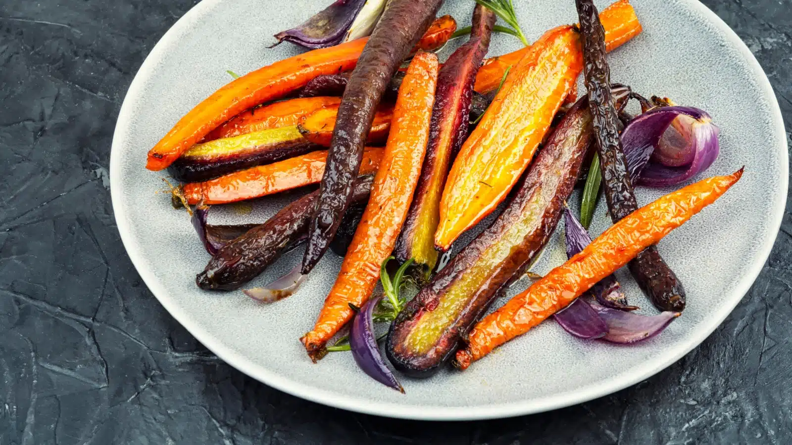 A plate of roasted carrots.