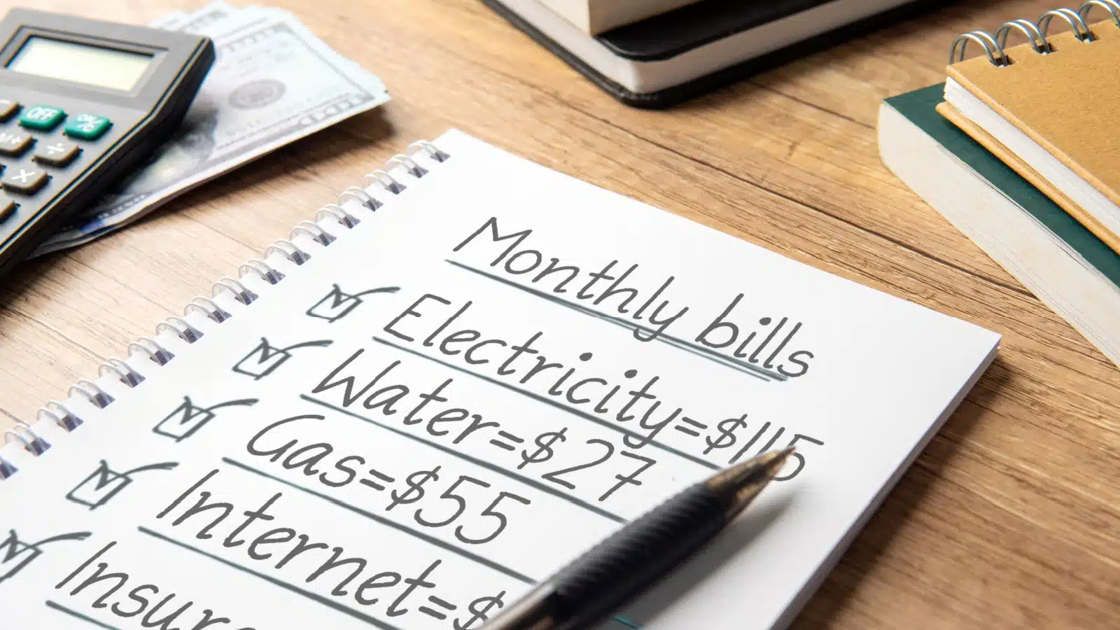 A handwritten note showcasing monthly bills.