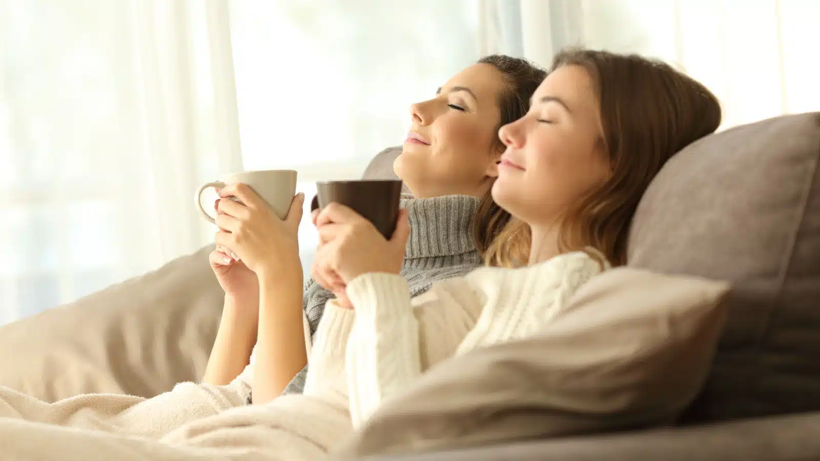 Roommates relaxing on the couch together represent the ambivert personality type. They're resting like an introvert while together like an extrovert.