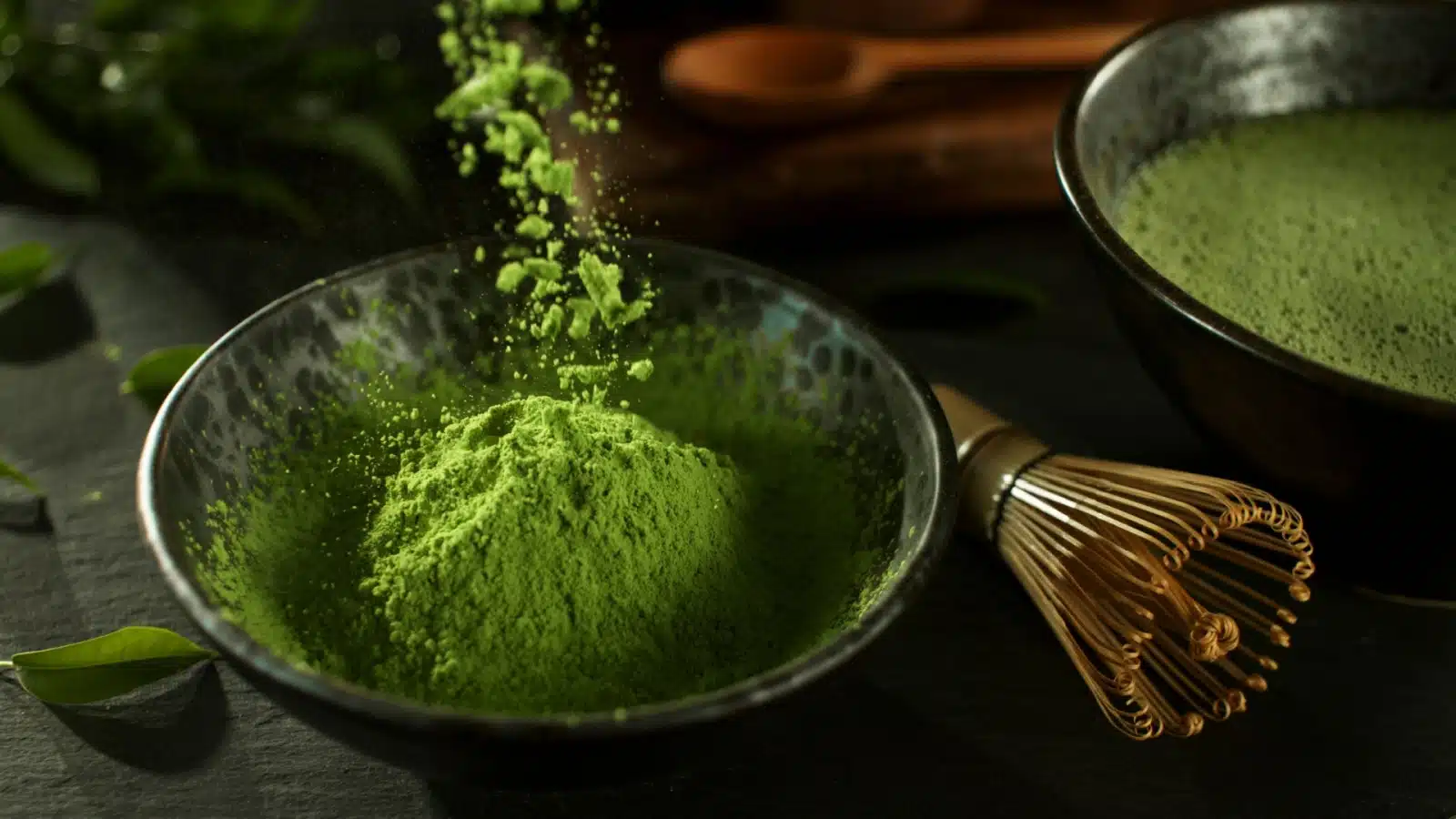 Matcha powder falling into a bowl.