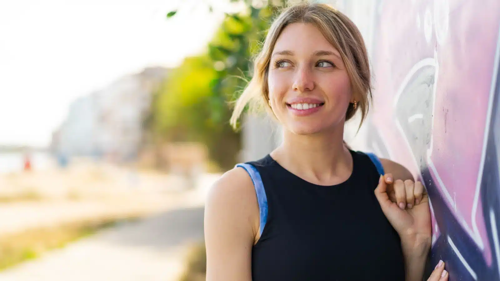 Portrait of an unattractive young woman outside.