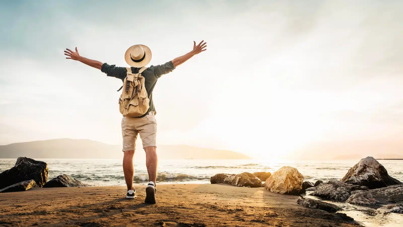 A happy man enjoying his journey out in the wilderness.